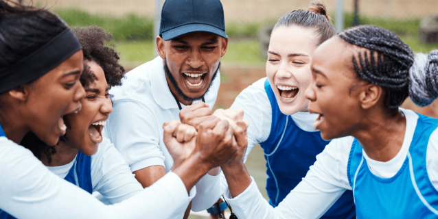 Coach in team huddle